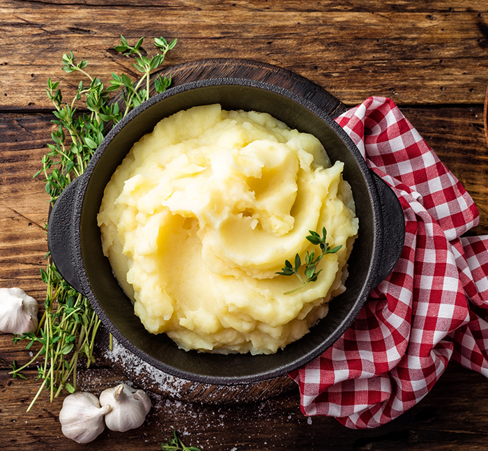 Bowl of mashed potatoes on a table