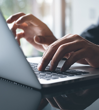 Person typing on a laptop