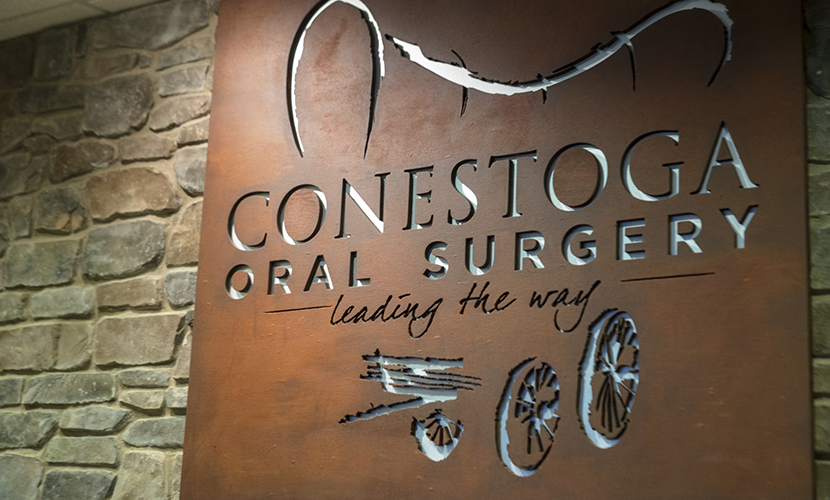 Wall art that reads Conestoga Oral Surgery leading the way