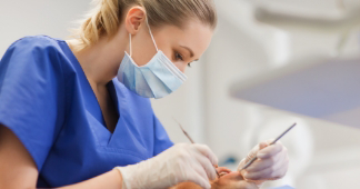 Oral surgeon examining a patients mouth