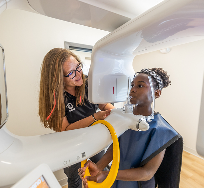 Oral surgery patient getting her teeth and jaws scanned