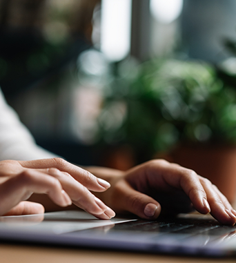 Person typing on a laptop